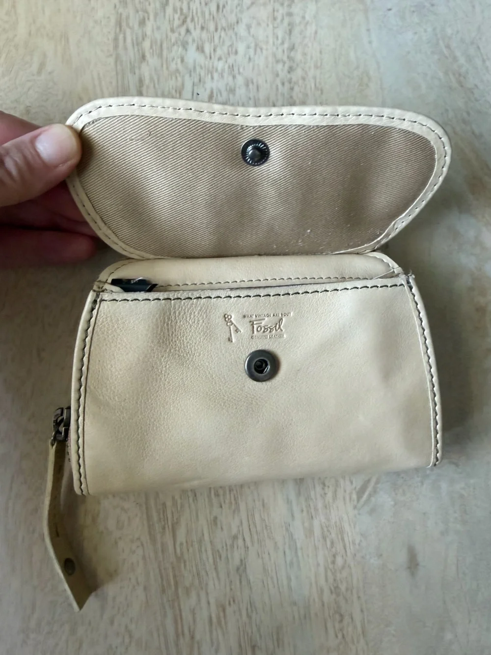 Fossil brand light Beige Patchwork Leather zip around Wallet with Button detail